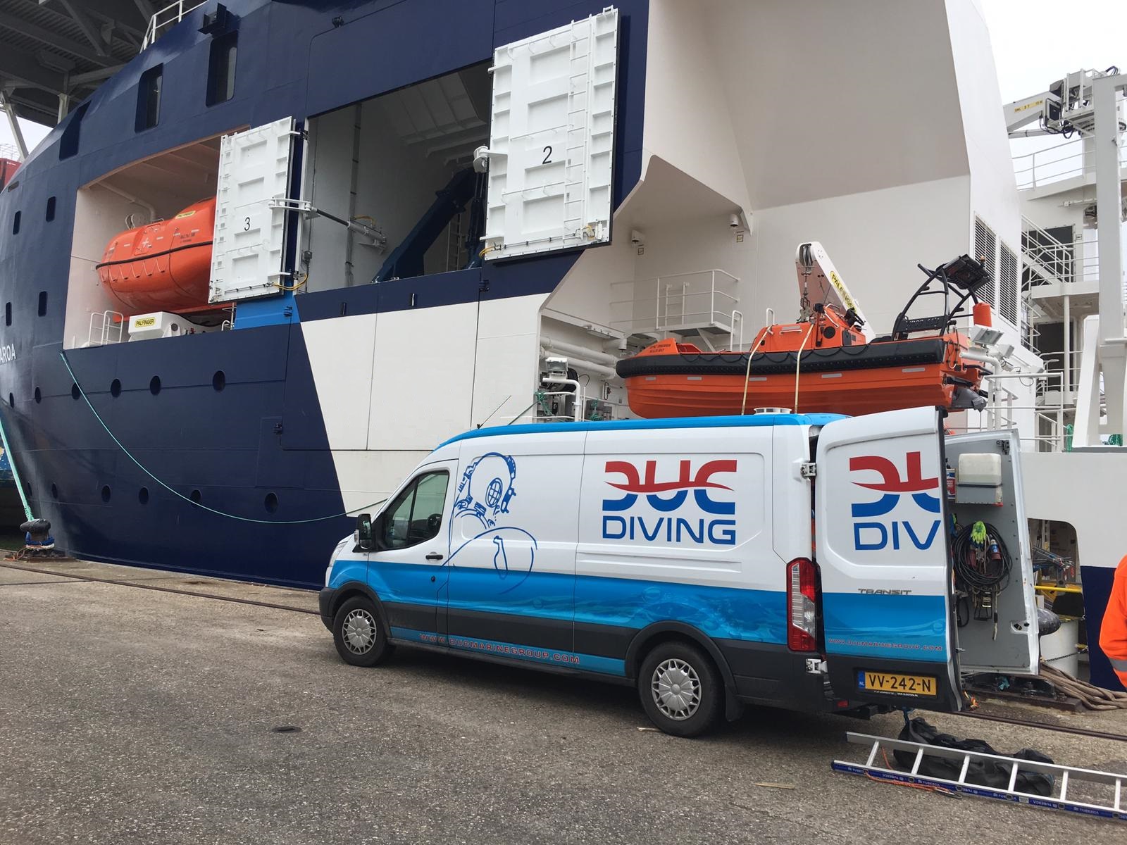 Picture of a diving van, next to a big offshore vessel. Ready to perform In-Water inspection.